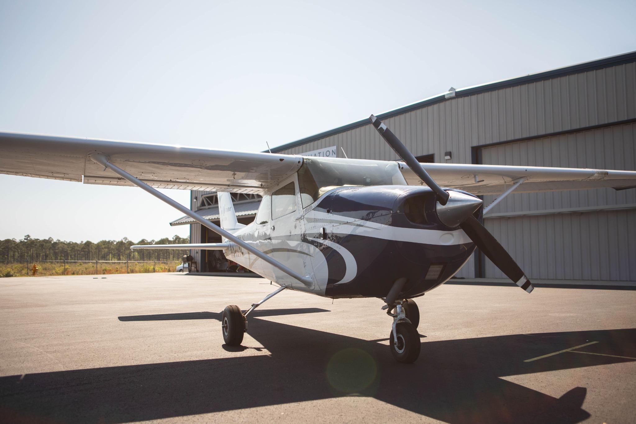 Cessna 172 parked at hangar