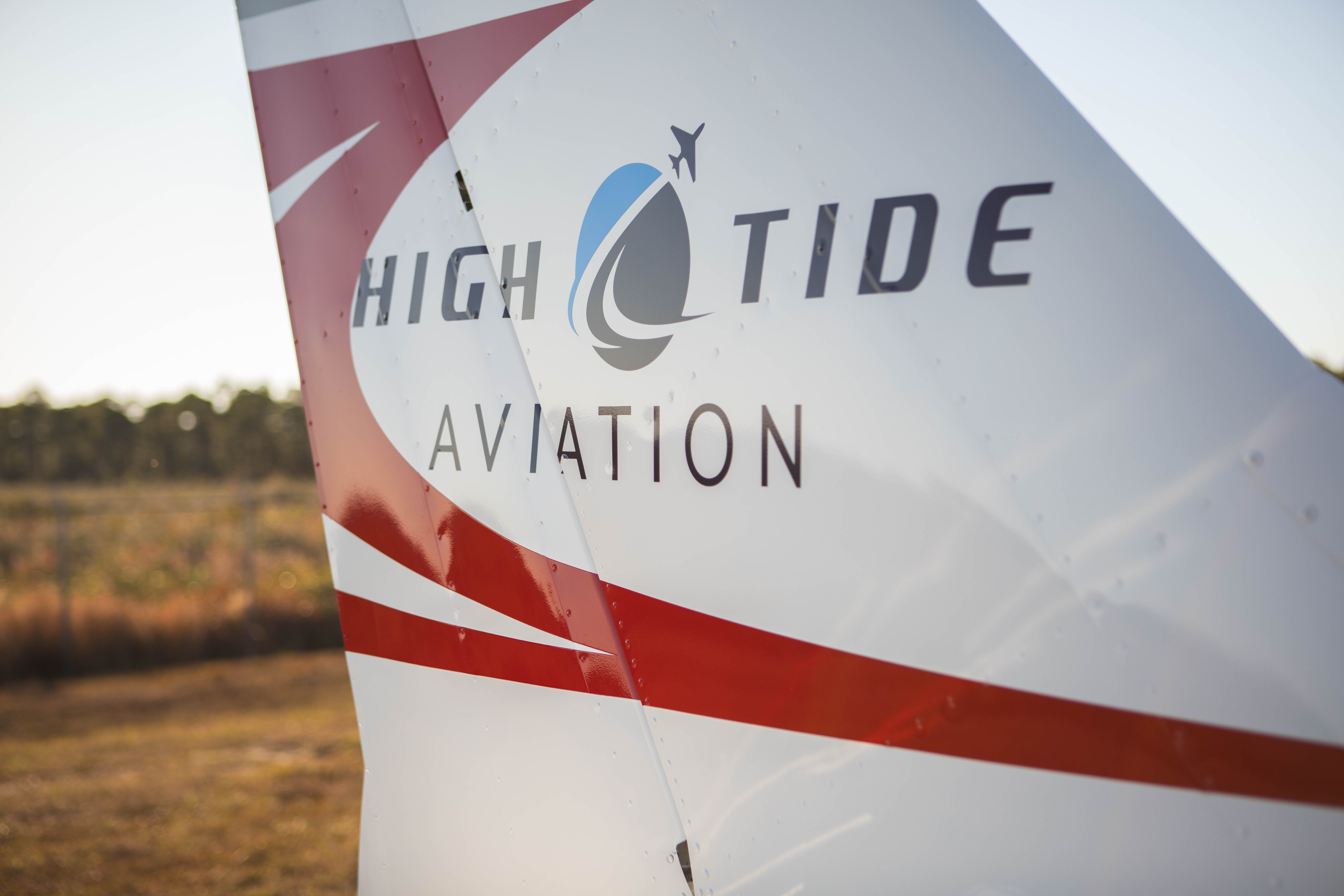 High Tide logo at the tail of a Cessna