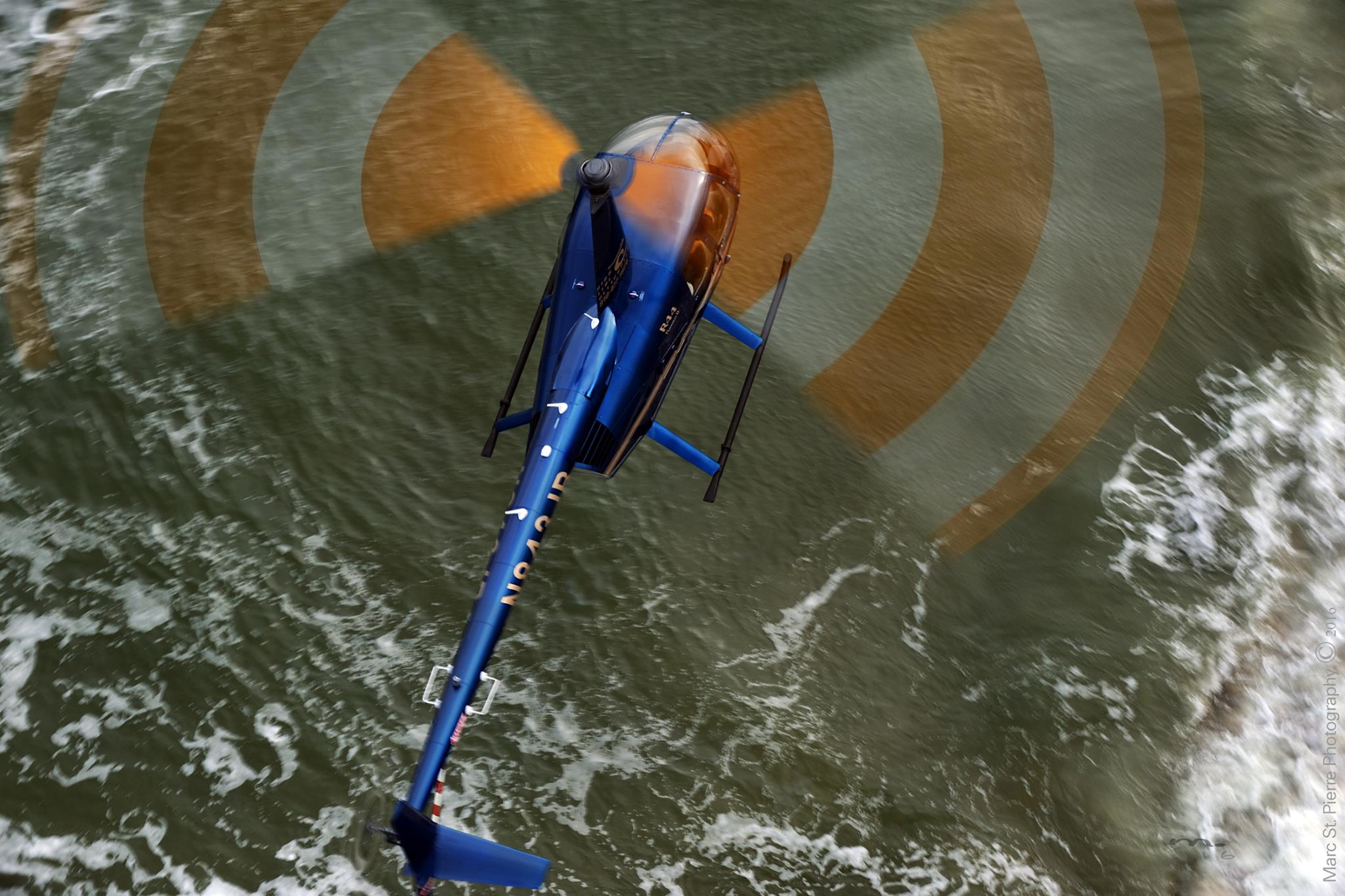 Robinson 44 Helicopter Flying Over the Carolina Coastline