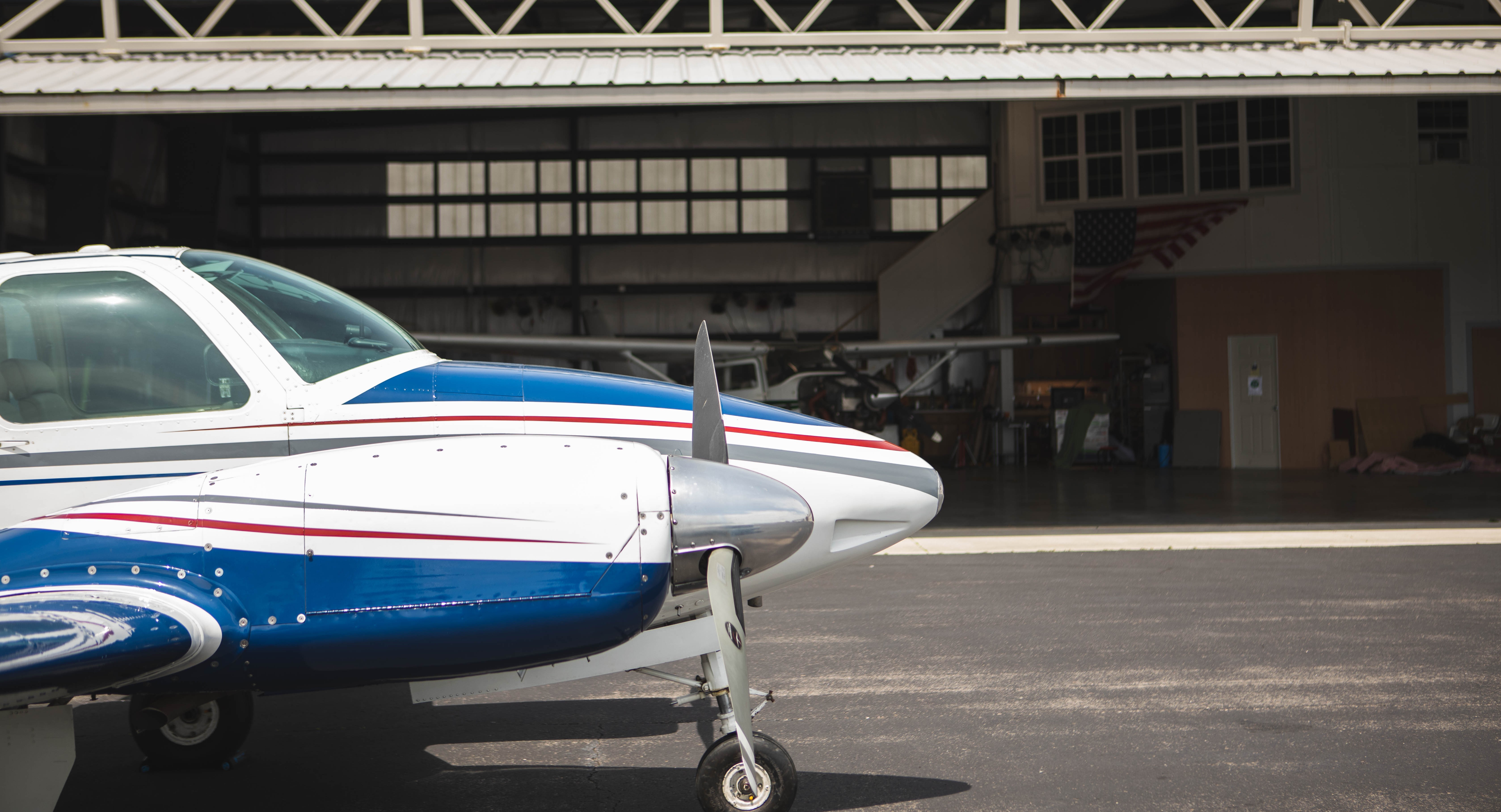 Beechcraft B55 Baron parked in front of the High Tide Aviation hangar